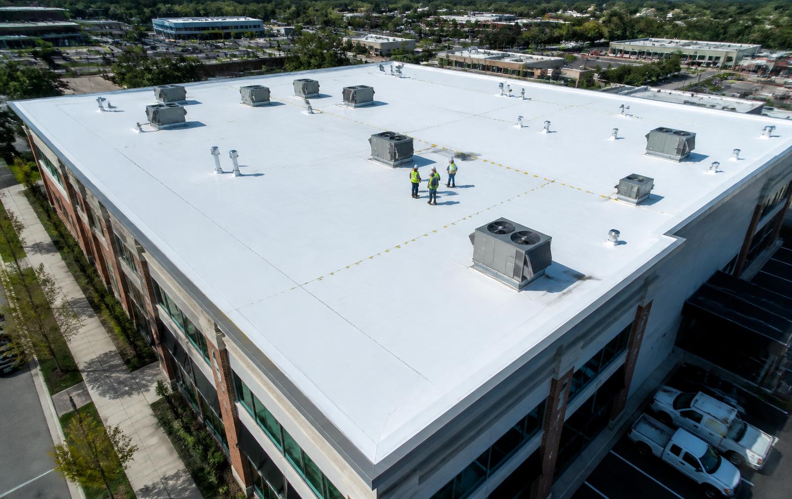 Illustrative photo of a commercial TPO membrane roof with rooftop HVAC units